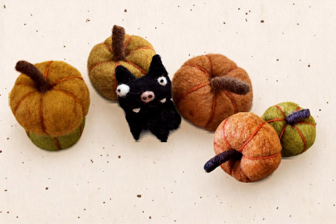 Wool felt pumpkins and a black cat for Halloween