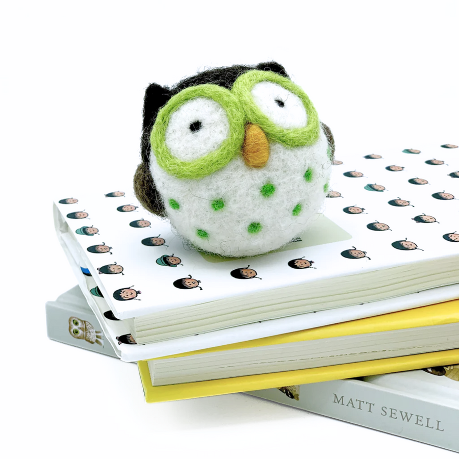 needle felted owl on top of books