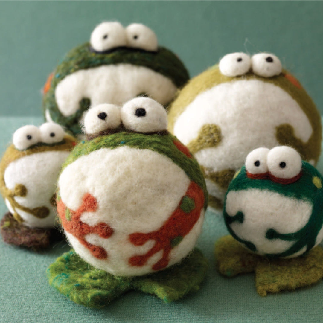group of felted frogs on waterlilies 