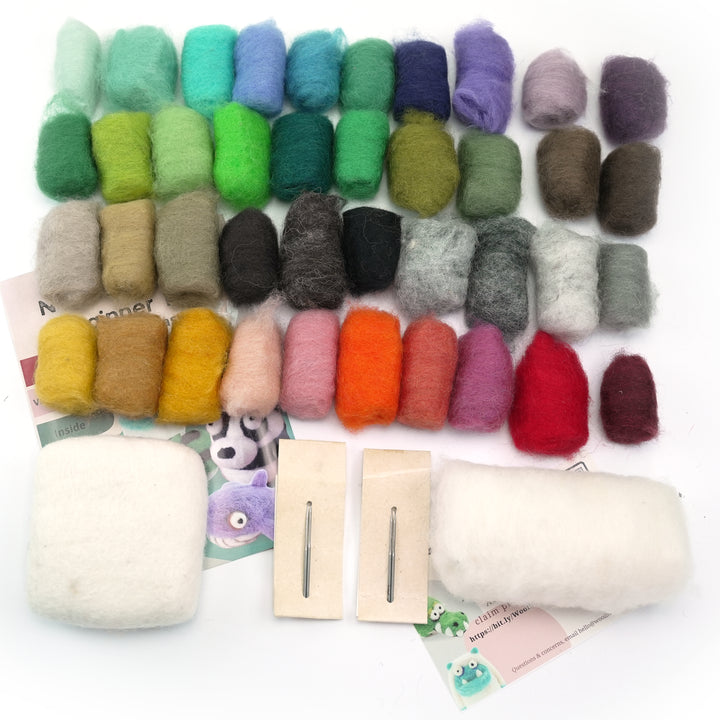 needle felting beginner kit materials: colored wool roving, 4 felting needles, mini felting mat, instruction booklet, card insert, and white wool roving